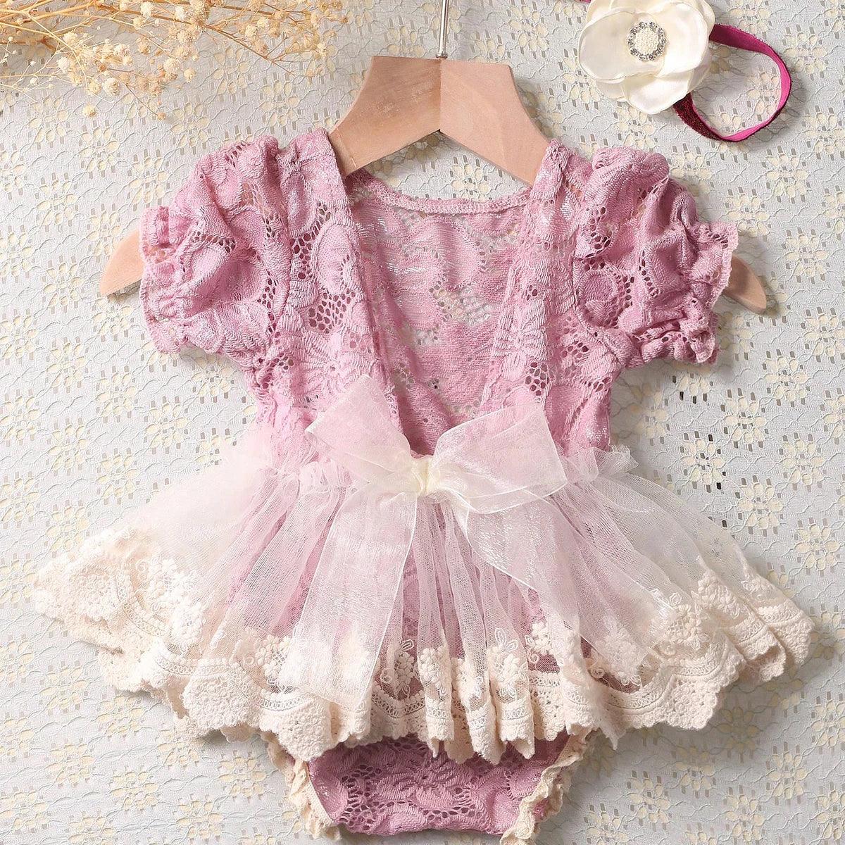 Dusty pink lace newborn romper with matching flower headband, delicate baby girl photo prop