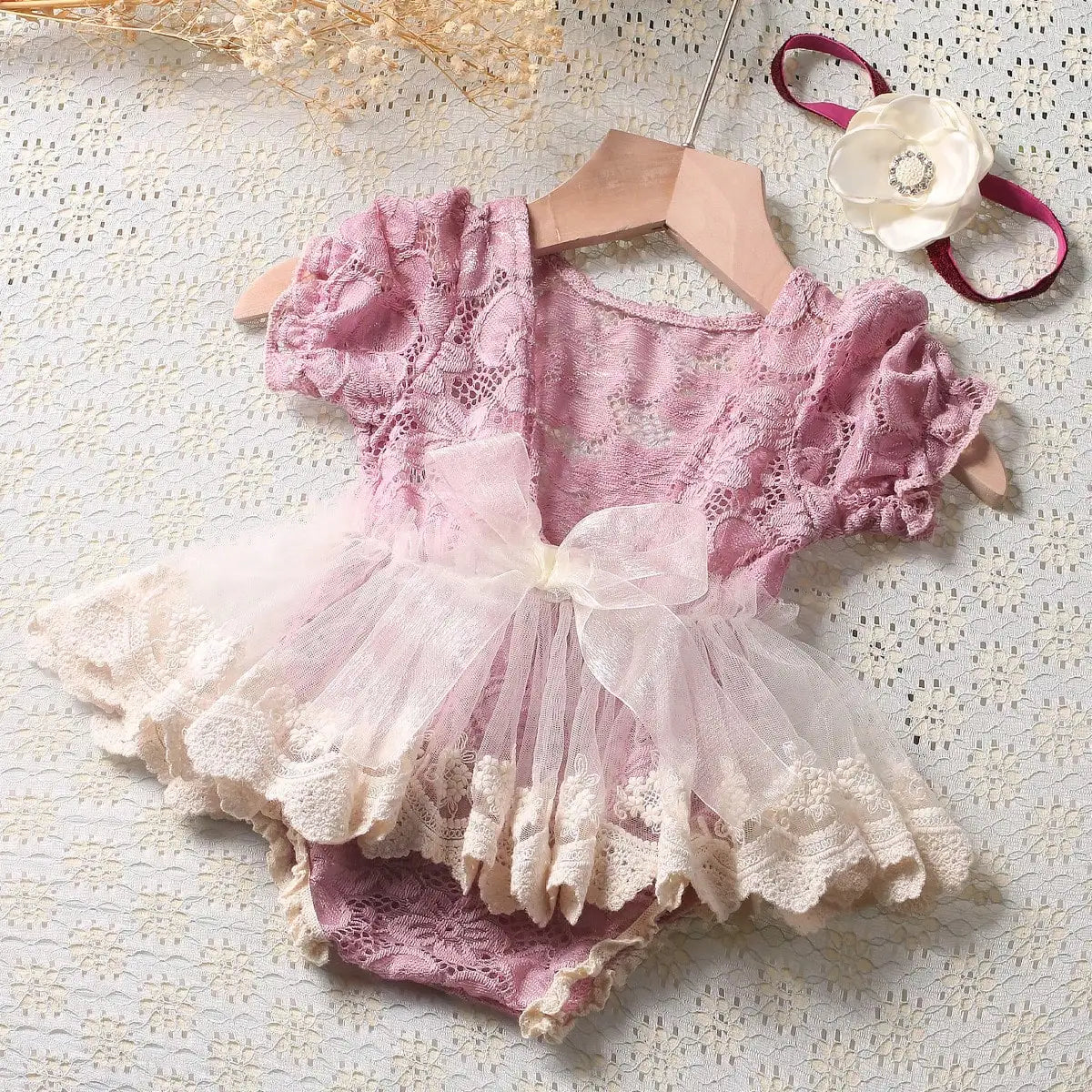 Adorable newborn girl dusty pink lace romper outfit with flower headband, perfect infant gift