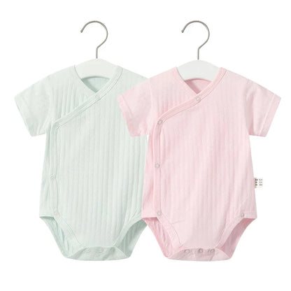 Newborn girl's casual summer wear: comfy cotton romper with elasticized leg openings.