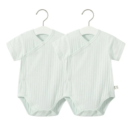 Adorable infant girl's summer fashion, a cotton v-neck romper designed for comfort.