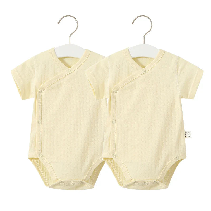 White cotton short-sleeve romper and coordinating shorts for newborn girls' summer fun.