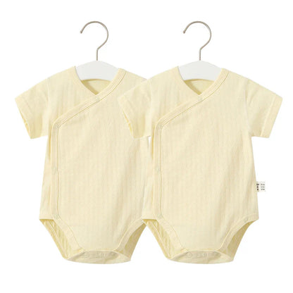 White cotton short-sleeve romper and coordinating shorts for newborn girls' summer fun.