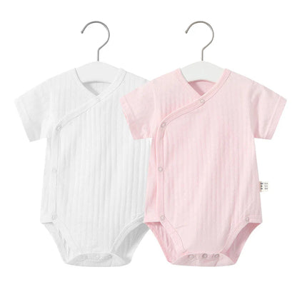 Floral print cotton romper and bow headband set, perfect for a newborn girl's summer day.