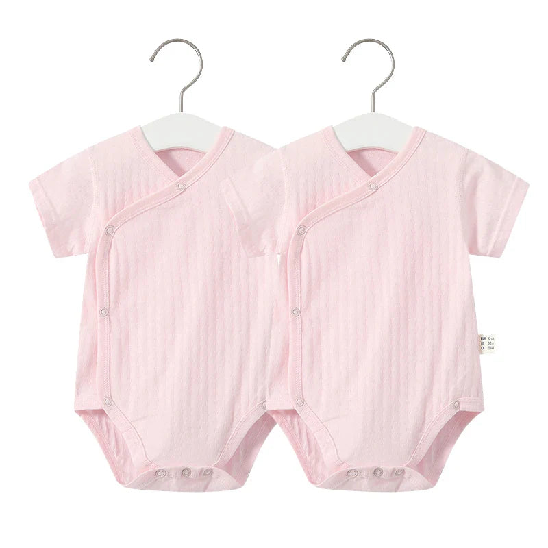 Newborn girl's comfy cotton romper and frilly shorts, a delightful summer baby fashion.