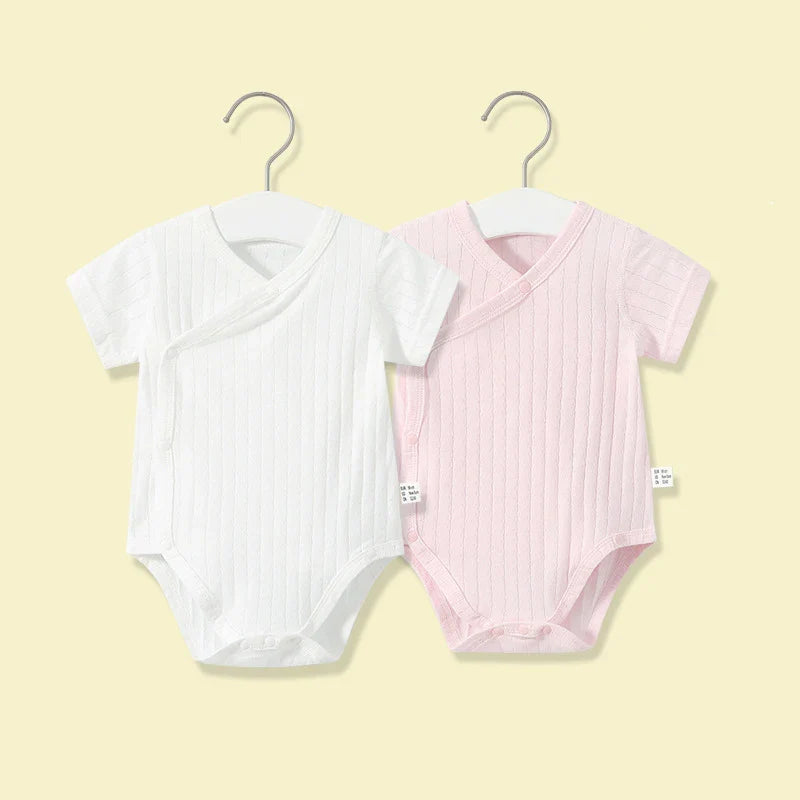Cute newborn girl's cotton romper and shorts set, ideal for warm weather comfort and play.