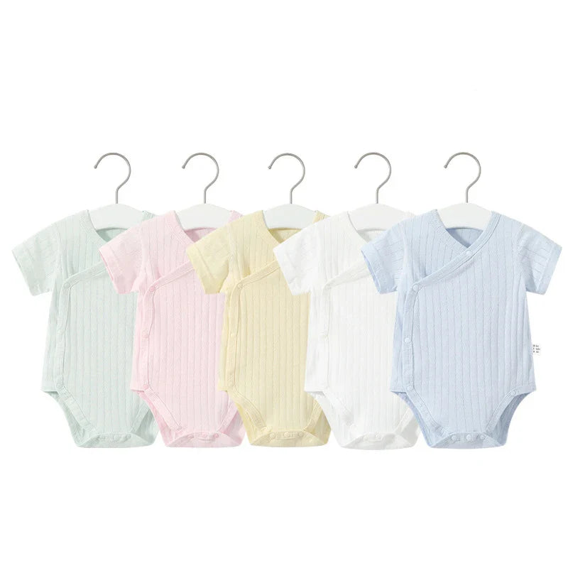 Two-piece baby girl's summer ensemble featuring a soft cotton romper and coordinating shorts.