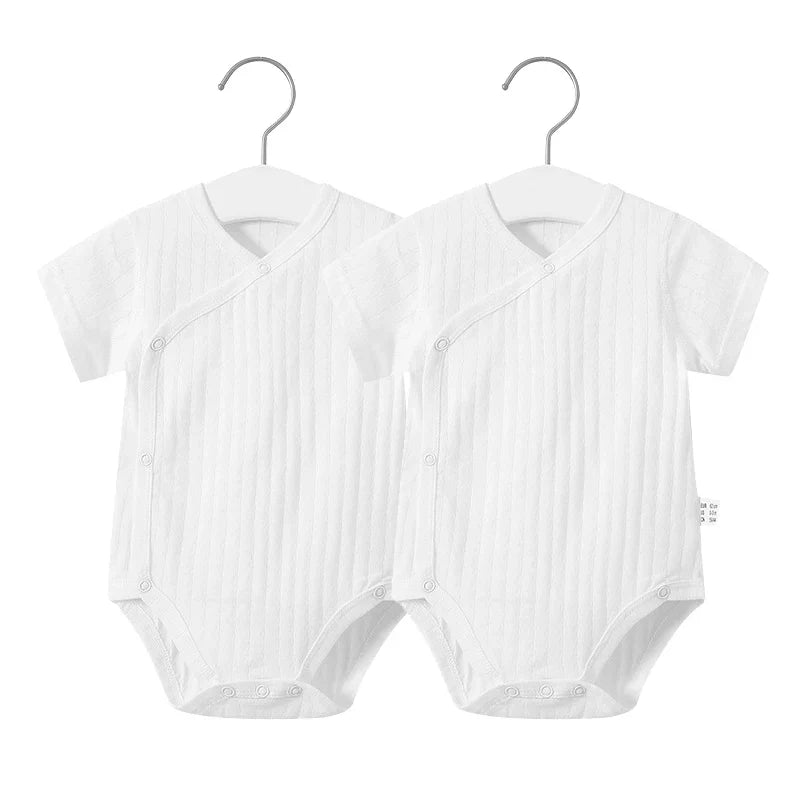 Sweet baby girl's summer clothing set, including a breathable cotton romper with bow detail.