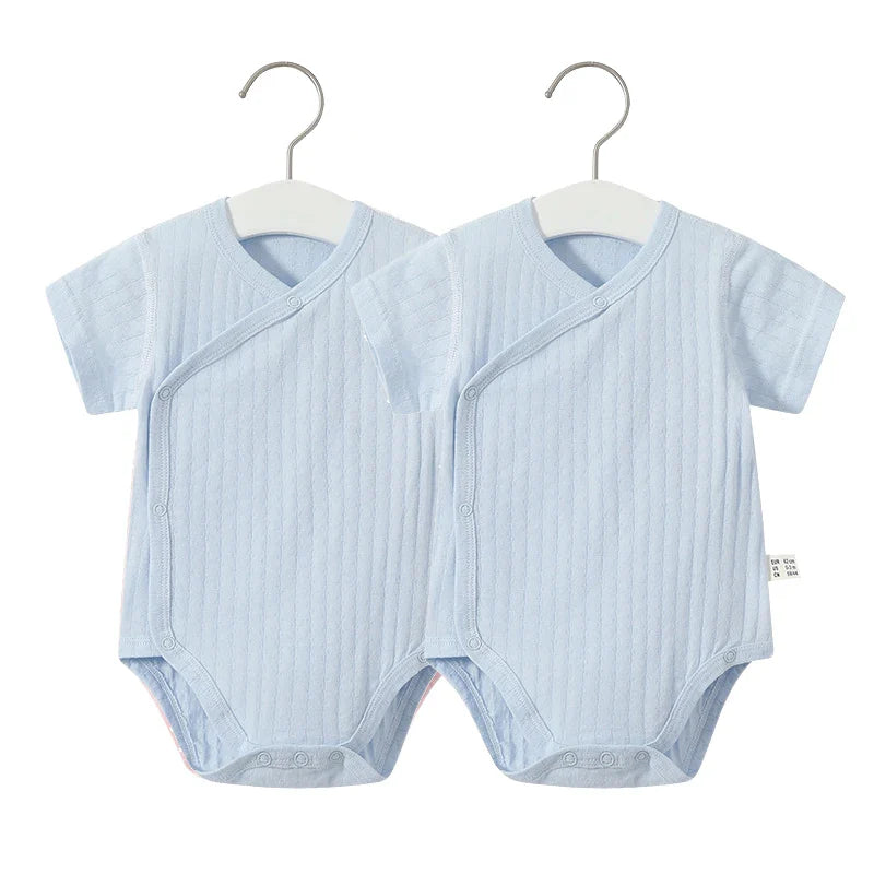 Infant girl's 2-piece cotton outfit, romper with short sleeves and matching soft shorts.