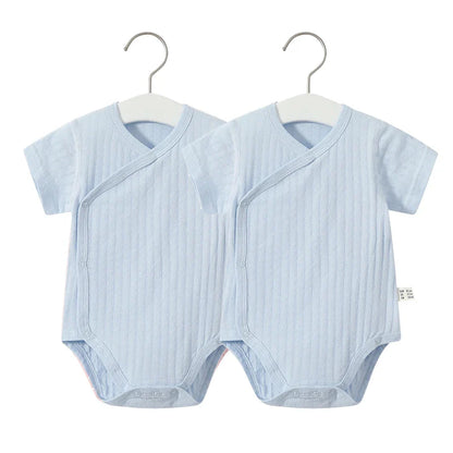 Infant girl's 2-piece cotton outfit, romper with short sleeves and matching soft shorts.