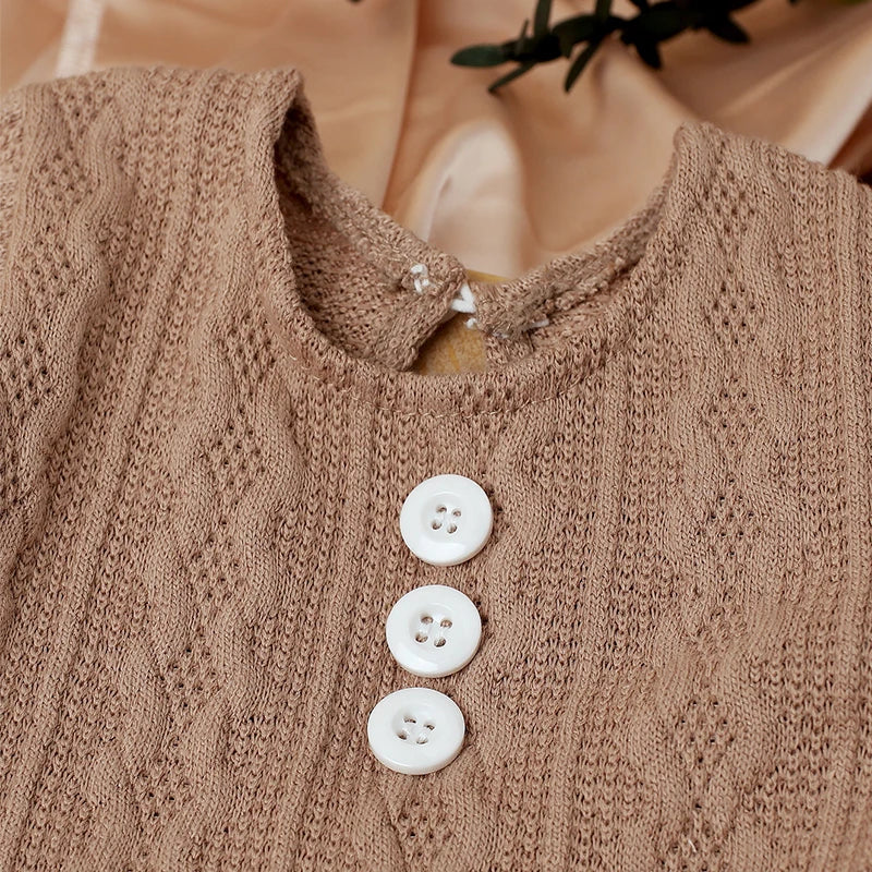Infant apparel for photo sessions: knit jumpsuit & pompom hat in neutral tone