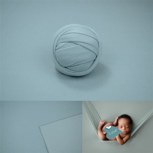Simple baby photo props: white swaddle and textured blanket, perfect for newborn sessions