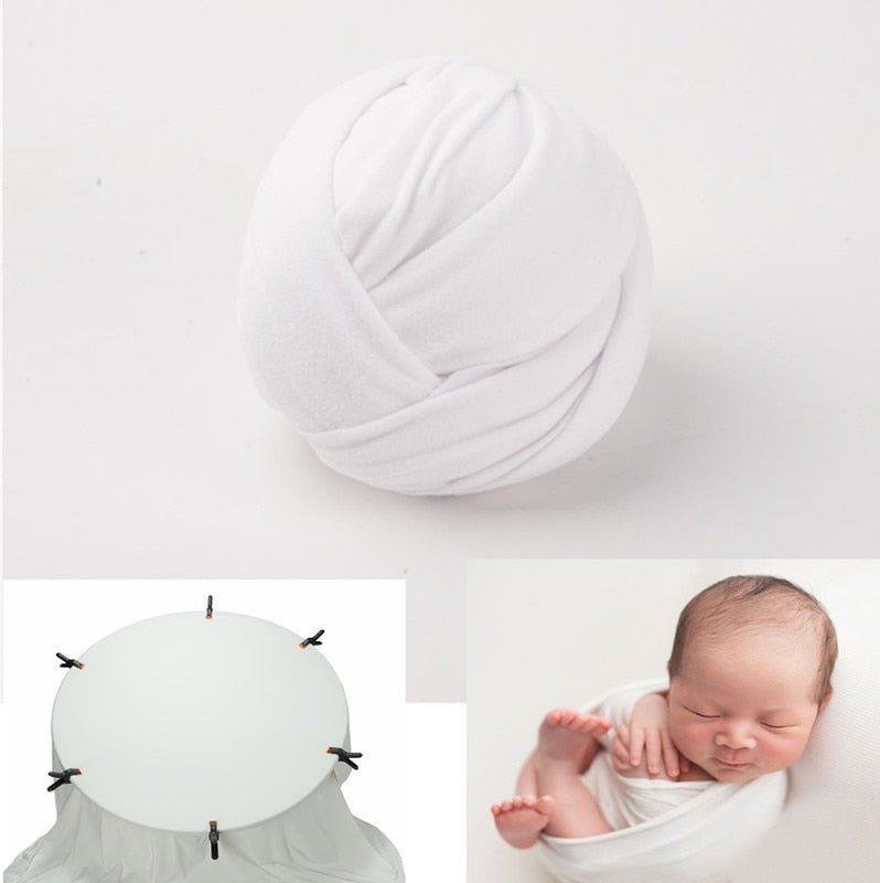 Soft baby swaddle wrap and textured background blanket, perfect for newborn photography