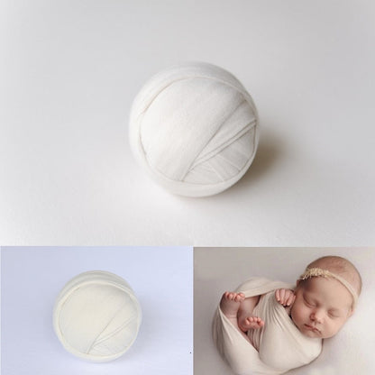 Two-piece baby photography set: stretch knit swaddle and crinkled fabric background blanket