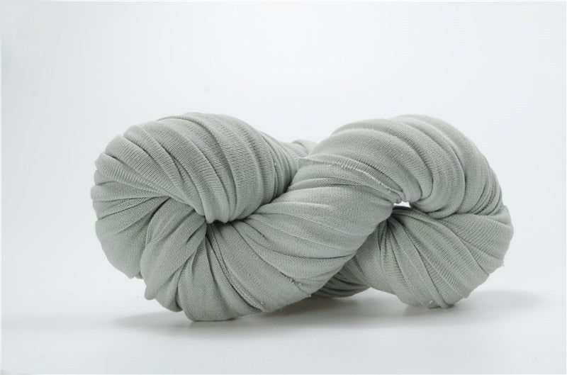 Close-up of a cozy cotton baby swaddle blanket with subtle texture, ideal for a newborn's delicate skin.
