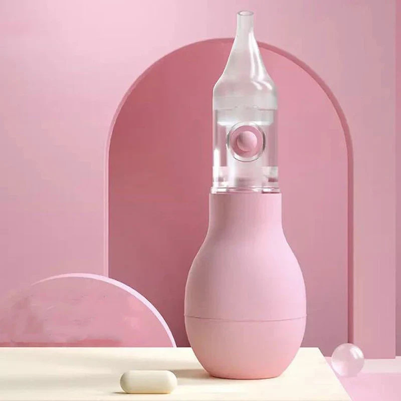 Parent holding silicone nasal aspirator for newborn, ensuring baby health and parent peace of mind