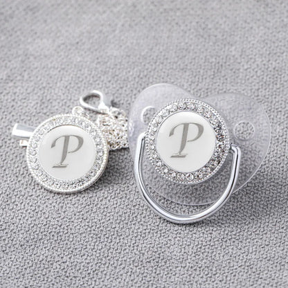 Adorable newborn silver bling pacifier with matching clip, stylish and safe for baby