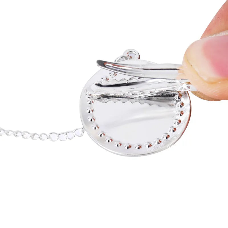 Unisex newborn silver bling pacifier and attached clip, silicone for infant comfort