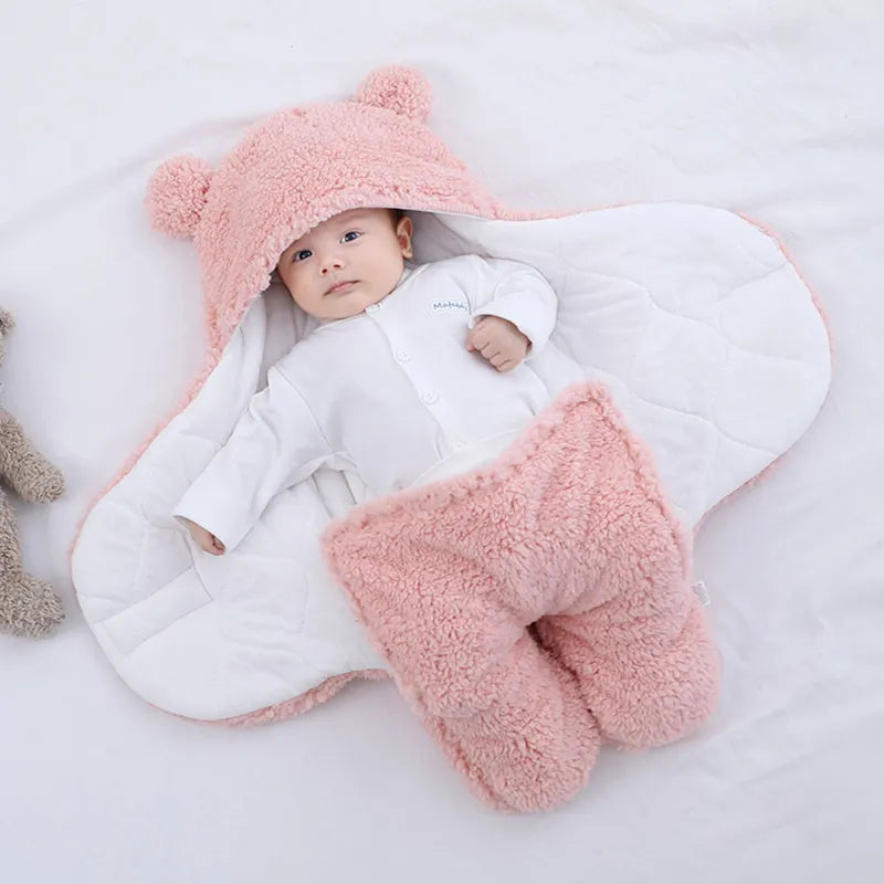 Newborn ultra-soft plush swaddle blanket sleeping bag in cream, ideal for cozy infant comfort.