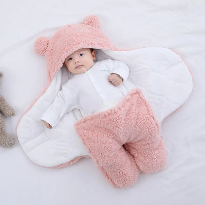 Newborn ultra-soft plush swaddle blanket sleeping bag in cream, ideal for cozy infant comfort.