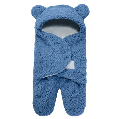Warm newborn swaddle in soft flannel, providing secure sleep and comfort for infants.