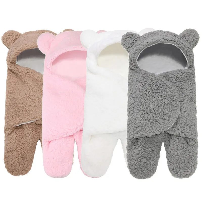 Plush newborn sleeping bag in a neutral shade, perfect for cozy infant bedding.