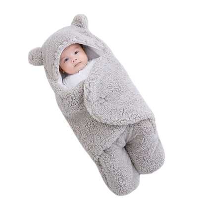 Pink newborn plush swaddle blanket, ideal for infant comfort and a secure sleeping environment.