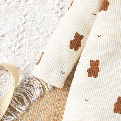 Seasonal baby wear: snug long sleeve cotton romper with bear motif for newborn comfort