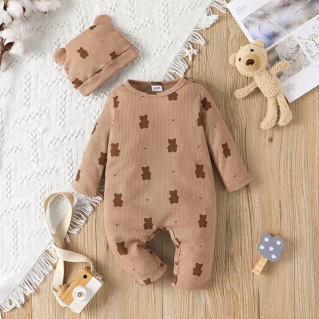 Unisex newborn white cotton romper with charming bear pattern, ideal long sleeve infant wear