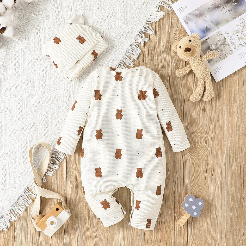 Close-up of bear print on a soft long sleeve cotton romper, comfortable baby apparel