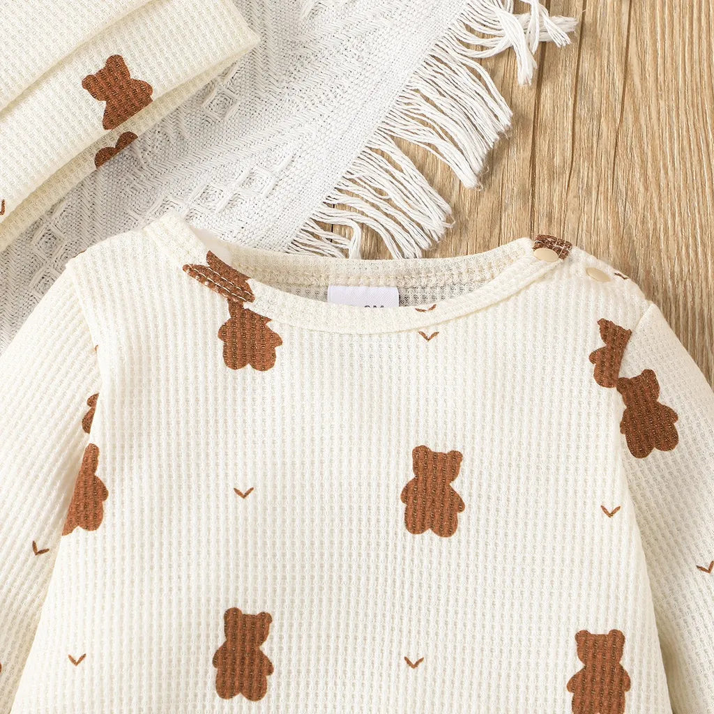 Newborn baby wearing a cozy long sleeve cotton bear print romper, unisex infant outfit