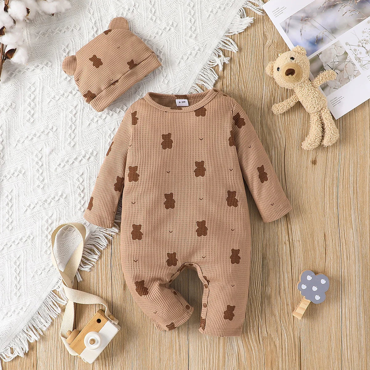 Organic cotton newborn romper featuring a sweet bear print, essential long sleeve baby clothing