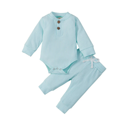 Unisex infant ribbed bodysuit showcasing a timeless plaid print with elastic pants.