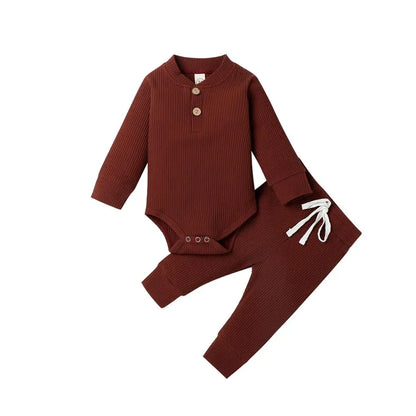 Two-piece newborn clothing set: ribbed plaid bodysuit and elastic waist pants.