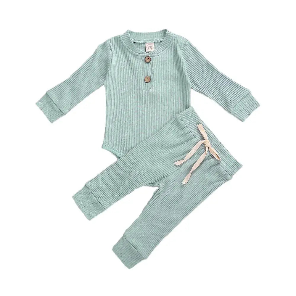 Soft cotton newborn outfit: ribbed plaid bodysuit paired with plain elastic pants.