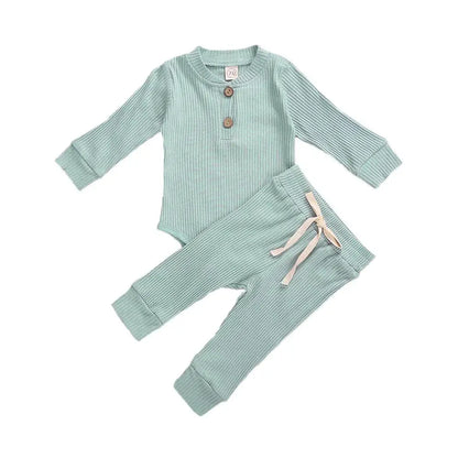 Soft cotton newborn outfit: ribbed plaid bodysuit paired with plain elastic pants.