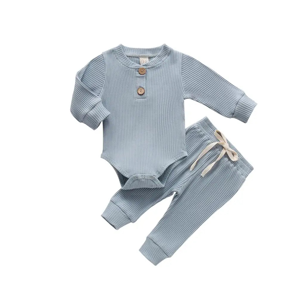 Cute newborn unisex outfit, a ribbed plaid bodysuit matched with soft cotton pants.