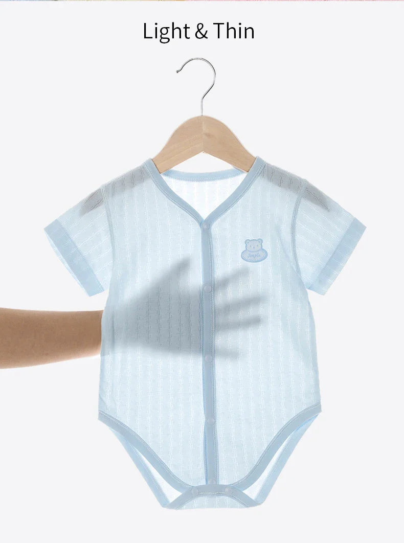 Close-up of the soft cotton fabric of a newborn unisex short sleeve bodysuit