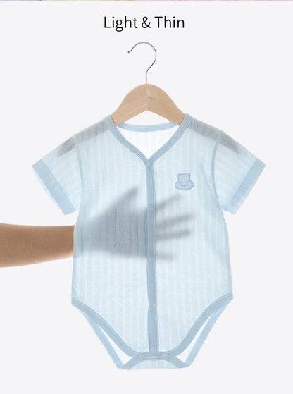 Close-up of the soft cotton fabric of a newborn unisex short sleeve bodysuit