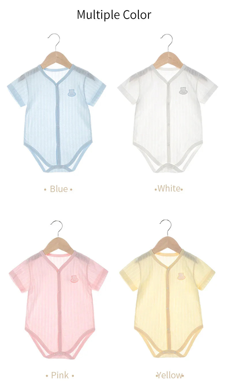 Summer baby outfit: light blue newborn unisex cotton short sleeve bodysuit on wooden background
