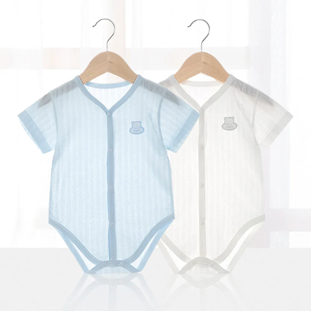 Close-up of a newborn unisex grey cotton short sleeve bodysuit with snap closure