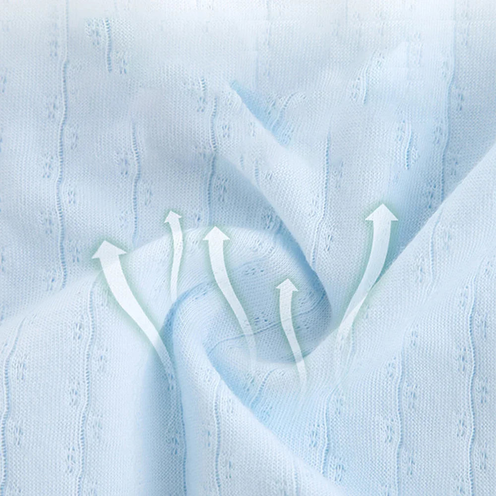 Stack of newborn unisex cotton short sleeve bodysuits in various pastel colors