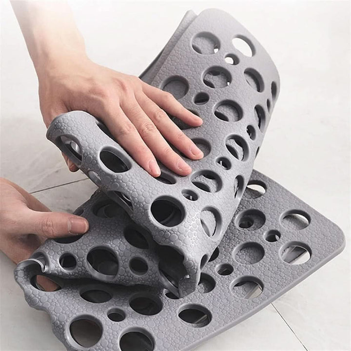 Non-slip bath mat protecting floors while ensuring secure footing in wet bathroom areas.
