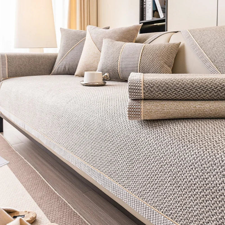 Modern non-slip sofa protector, cotton-linen blend, enhances living room decor. All season comfort.
