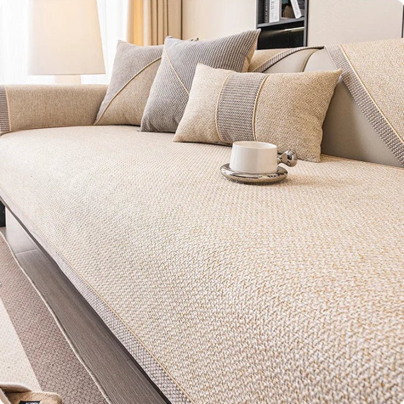 All-season cotton-linen blend sofa protector, non-slip design, ideal for a cozy living room.