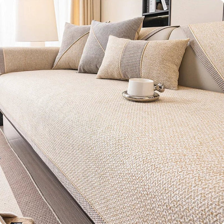 All-season cotton-linen blend sofa protector, non-slip design, ideal for a cozy living room.