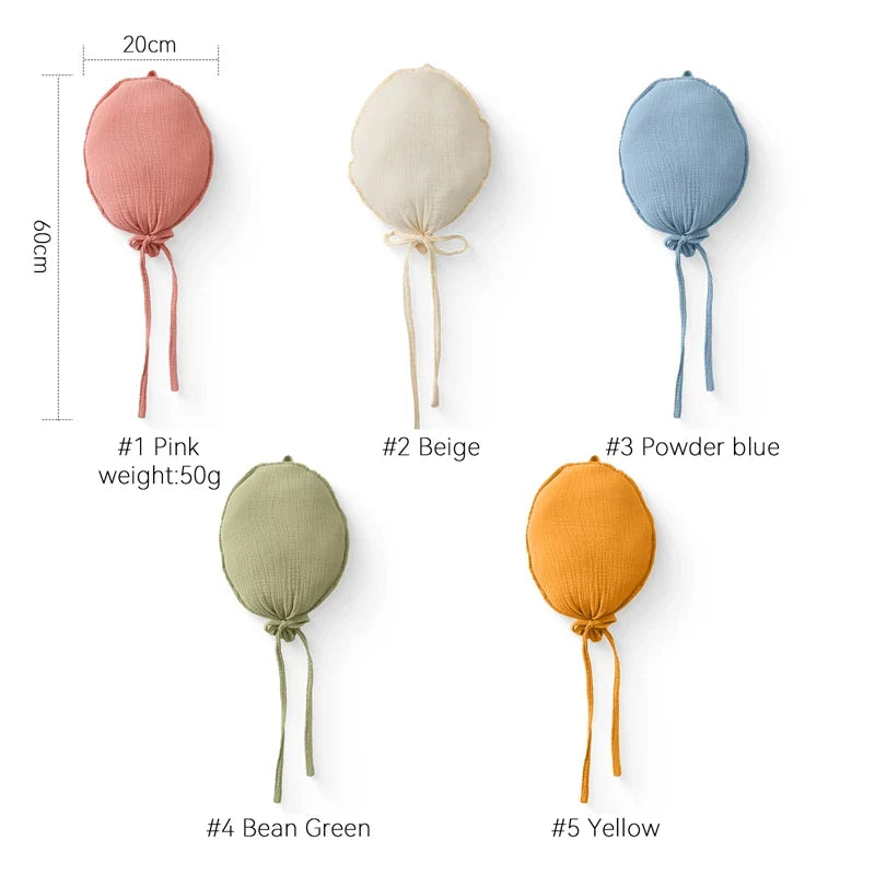 Close-up of a white cotton balloon baby pillow, showing soft texture and quality for nursery