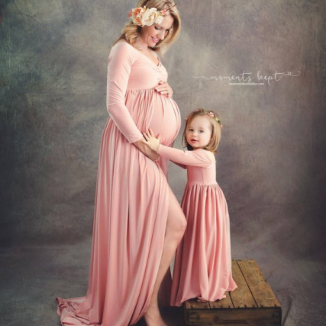 Elegant women's off-shoulder maxi dress in white, a versatile maternity dress and matching outfit option.