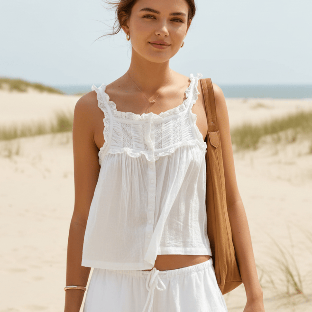 Off-white women's lace trim crop top, boho festival style. Sleeveless with ruffle hem, perfect for summer fashion.