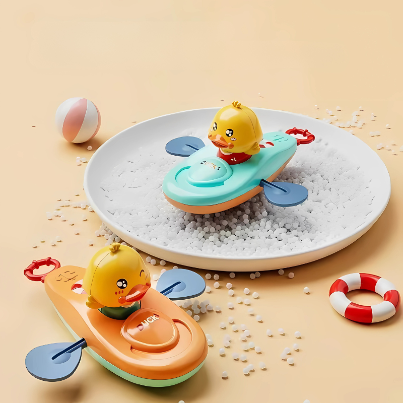 Orange wind-up paddling duck bath toy for kids playing in water, promoting developmental skills.