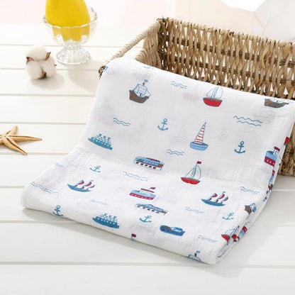 Close-up of a white baby muslin swaddle blanket, enhancing infant sleep and nursery decor